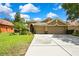 Lovely home featuring a three car garage and manicured lawn, perfect for curb appeal at 11101 Ragsdale Ct, New Port Richey, FL 34654