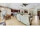 Open-concept layout of living room and kitchen featuring modern decor and abundant natural light at 11101 Ragsdale Ct, New Port Richey, FL 34654