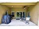 Enjoy outdoor living on this covered patio with a ceiling fan and comfortable seating at 11101 Ragsdale Ct, New Port Richey, FL 34654