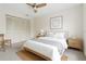 Bright bedroom featuring minimalist decor, a large window, and spacious closet at 11621 Pear Tree Dr, New Port Richey, FL 34654