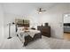 Cozy bedroom with a rustic wood bed, dresser, and soft carpet flooring at 11621 Pear Tree Dr, New Port Richey, FL 34654