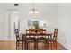 Inviting dining room with hardwood floors and lots of natural light at 11621 Pear Tree Dr, New Port Richey, FL 34654