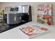 Close-up of stainless steel stove, countertops, and cookbooks in the kitchen at 11621 Pear Tree Dr, New Port Richey, FL 34654