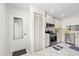 Bright kitchen with stainless steel appliances and tile floors, convenient access to garage at 11621 Pear Tree Dr, New Port Richey, FL 34654