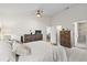 Serene bedroom with soft carpet, neutral tones, and en-suite bathroom access at 11621 Pear Tree Dr, New Port Richey, FL 34654
