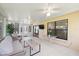 Relaxing sunroom with tiled flooring, comfortable furniture, and tranquil views of the outdoors at 11621 Pear Tree Dr, New Port Richey, FL 34654