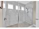 Modern shower with frameless glass doors and sleek tile work at 11876 Ranchers Gap Dr, Odessa, FL 33556
