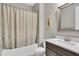 Bathroom with tub-shower combo and updated vanity at 11876 Ranchers Gap Dr, Odessa, FL 33556