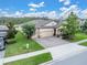 Beautiful single-story home boasting a large yard, stone accents, and a three car driveway at 11876 Ranchers Gap Dr, Odessa, FL 33556