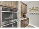 Gourmet kitchen featuring built-in stainless steel appliances and rich wood cabinetry at 11876 Ranchers Gap Dr, Odessa, FL 33556