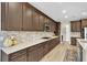Open-concept kitchen with a large island, granite countertops, and stainless steel appliances at 11876 Ranchers Gap Dr, Odessa, FL 33556
