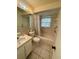 Bathroom with vanity, toilet, and tub/shower combination at 12104 Boynton Ln, New Port Richey, FL 34654