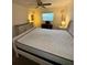 Bedroom featuring a comfortable bed, dresser, ceiling fan, and a bright window at 12104 Boynton Ln, New Port Richey, FL 34654