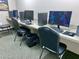Well-lit computer room equipped with multiple computers and chairs for convenient access at 12104 Boynton Ln, New Port Richey, FL 34654