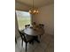 Cozy dining area with a round table and chairs, perfect for intimate meals at 12104 Boynton Ln, New Port Richey, FL 34654
