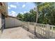 Paver patio offers an outdoor seating area, complemented by a privacy fence and well-kept landscaping at 13600 Crest Lake Dr, Hudson, FL 34669