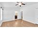 Bedroom featuring hardwood floors, natural light, and ensuite bathroom at 13600 Crest Lake Dr, Hudson, FL 34669