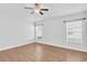 Spacious bedroom features hardwood floors and two large windows at 13600 Crest Lake Dr, Hudson, FL 34669