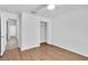 Bedroom featuring hardwood floors, closet, and ensuite access at 13600 Crest Lake Dr, Hudson, FL 34669