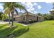 Charming single story home featuring mature landscaping and a two car garage at 13600 Crest Lake Dr, Hudson, FL 34669