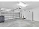 Spacious garage featuring painted walls and ample storage space at 13600 Crest Lake Dr, Hudson, FL 34669