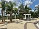 A relaxing community pool with lounge chairs and palm trees offers a resort-like feel at 13600 Crest Lake Dr, Hudson, FL 34669