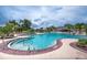 Enjoy a large community pool and spa surrounded by lush landscaping, perfect for relaxation and social gatherings at 13600 Crest Lake Dr, Hudson, FL 34669