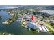An aerial view of a condominium community and complex, featuring a pool and waterfront access at 1365 Snell Isle Ne Blvd # 1B, St Petersburg, FL 33704