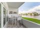 Balcony with outdoor table and chairs overlooking the canal at 1365 Snell Isle Ne Blvd # 1B, St Petersburg, FL 33704