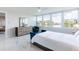 Bedroom with water view, large windows, and white tile floor at 1365 Snell Isle Ne Blvd # 1B, St Petersburg, FL 33704