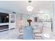 Open concept kitchen and dining area with new floors, lighting, stainless steel appliances and fireplace at 1365 Snell Isle Ne Blvd # 1B, St Petersburg, FL 33704