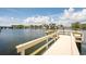 View of private community dock leading to waterfront homes and boat access on a sunny day at 1365 Snell Isle Ne Blvd # 1B, St Petersburg, FL 33704