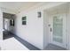 A modern exterior hallway featuring a unit door with glass, new paint and updated lighting at 1365 Snell Isle Ne Blvd # 1B, St Petersburg, FL 33704