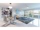 Spacious living room with dining area, sliding glass doors to balcony, and comfortable seating with water views at 1365 Snell Isle Ne Blvd # 1B, St Petersburg, FL 33704