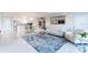 Stylish living room that flows into the dining area and kitchen, creating an open and airy living space at 1365 Snell Isle Ne Blvd # 1B, St Petersburg, FL 33704
