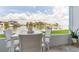 Relax and enjoy the waterfront view from this condo's patio with comfortable white seating and views at 1365 Snell Isle Ne Blvd # 1B, St Petersburg, FL 33704