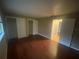 Bedroom features hardwood floors, neutral walls and double closets at 1392 Piper Rd, Spring Hill, FL 34606
