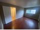 Bedroom with hardwood flooring, closet, and an ensuite bathroom at 1392 Piper Rd, Spring Hill, FL 34606