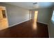 Bedroom view features wood laminate floor, closet and neutral painted walls at 1392 Piper Rd, Spring Hill, FL 34606