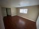 Bedroom featuring laminate wood floor, neutral walls and window for natural light at 1392 Piper Rd, Spring Hill, FL 34606