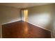 Bedroom featuring hardwood floors, a window, and a closet with a door at 1392 Piper Rd, Spring Hill, FL 34606
