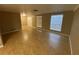 Bright living room featuring tile floors, neutral walls, and windows for natural light at 1392 Piper Rd, Spring Hill, FL 34606