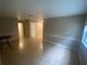 Living room featuring neutral paint, white trim, and tile floors, offering a versatile space at 1392 Piper Rd, Spring Hill, FL 34606