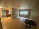 Bright living room featuring a kitchen view, neutral paint, white trim and tile floors at 1392 Piper Rd, Spring Hill, FL 34606