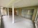 View of the screened in porch with multiple access points to the home at 1392 Piper Rd, Spring Hill, FL 34606