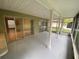 A screened in porch with exterior views and access to the home at 1392 Piper Rd, Spring Hill, FL 34606
