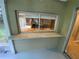Exterior window on the porch with granite bar and kitchen view at 1392 Piper Rd, Spring Hill, FL 34606