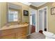 Bathroom features a stylish vanity with a decorative mirror and a separate shower room at 1430 Rosetree Ct, Clearwater, FL 33764