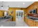 Well-lit kitchen with granite countertops, wooden cabinets, and modern stainless steel appliances at 1430 Rosetree Ct, Clearwater, FL 33764