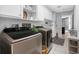 Well-organized laundry room with modern washer and dryer and storage at 1430 Rosetree Ct, Clearwater, FL 33764